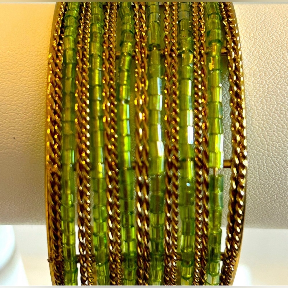 60’s VINTAGE Vintage Green Glass Seed Bead & Gold
Tone Clamper Bracelet.